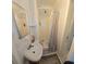 Bright bathroom with a white sink, shower, gray tile and shower curtain at 1755 Sunset Point Rd, Clearwater, FL 33755
