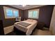 Bedroom with modern decor featuring an area rug and shutters at 1755 Sunset Point Rd, Clearwater, FL 33755