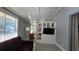 Bright living room featuring a coffered ceiling, large window and neutral paint at 1755 Sunset Point Rd, Clearwater, FL 33755