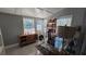 Bright office space featuring a glass-top desk, coffered ceiling and natural light at 1755 Sunset Point Rd, Clearwater, FL 33755