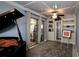 Stylish office area with custom bookshelves, coffered ceiling, and access to the sunroom at 1755 Sunset Point Rd, Clearwater, FL 33755