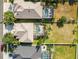 Aerial view of multiple properties showcasing pools, manicured lawns, and neighborhood layouts at 1858 Mira Lago Cir, Ruskin, FL 33570