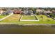 Fenced backyard with a lovely pool and waterfront views that provide a calming oasis at 1858 Mira Lago Cir, Ruskin, FL 33570