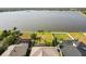 Backyard with expansive lake views, complemented by lush greenery and a tranquil setting at 1858 Mira Lago Cir, Ruskin, FL 33570