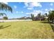 Wide backyard provides ample space and features a white fence for privacy and clear boundaries at 1858 Mira Lago Cir, Ruskin, FL 33570