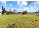 Vast backyard with a neatly kept lawn offers plenty of space and privacy with neighboring homes nearby at 1858 Mira Lago Cir, Ruskin, FL 33570