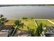 Spacious backyard offering serene lake views, ideal for outdoor relaxation and entertaining at 1858 Mira Lago Cir, Ruskin, FL 33570