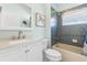 Charming bathroom with a colorful tile shower and turtle themed artwork, adding a unique touch at 1858 Mira Lago Cir, Ruskin, FL 33570