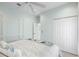 Bedroom with bright decor, a ceiling fan, and closet, providing comfort and style at 1858 Mira Lago Cir, Ruskin, FL 33570