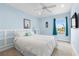 Light-filled bedroom boasts a waterfront view, and comfortable bed with stylish decor at 1858 Mira Lago Cir, Ruskin, FL 33570