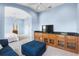 Open-concept room with a large entertainment cabinet and comfortable seating, perfect for relaxation at 1858 Mira Lago Cir, Ruskin, FL 33570