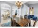 Open-concept dining area with wooden table and chairs, seamlessly connecting to the living spaces at 1858 Mira Lago Cir, Ruskin, FL 33570