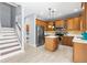 Updated kitchen with a staircase view, stainless steel refrigerator and center island at 1858 Mira Lago Cir, Ruskin, FL 33570