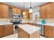 Bright kitchen featuring granite countertops, modern appliances, and ample cabinet space at 1858 Mira Lago Cir, Ruskin, FL 33570