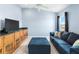 Cozy bonus room with custom cabinetry, a comfortable sofa, and ample natural light at 1858 Mira Lago Cir, Ruskin, FL 33570