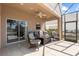 Inviting screened patio with comfortable seating, perfect for entertaining or relaxing outdoors at 1858 Mira Lago Cir, Ruskin, FL 33570