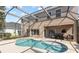 Beautiful pool and patio area with a screened enclosure, ideal for enjoying outdoor living at 1858 Mira Lago Cir, Ruskin, FL 33570