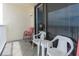A cozy balcony featuring tile flooring and comfortable seating offers a relaxing outdoor space at 18650 Gulf Blvd # 203, Indian Shores, FL 33785