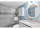 Bathroom featuring a shower with glass doors, a vanity, a toilet, and updated features at 18650 Gulf Blvd # 203, Indian Shores, FL 33785