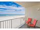 Enjoy the beach views from the balcony with seating area at 18650 Gulf Blvd # 203, Indian Shores, FL 33785