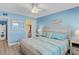 Stylish bedroom with a coastal theme, featuring wood-look flooring and a large closet for storage at 18650 Gulf Blvd # 203, Indian Shores, FL 33785