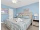 Beautiful bedroom with lamps, and wood-look floors, providing a relaxing retreat at 18650 Gulf Blvd # 203, Indian Shores, FL 33785