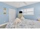 Charming bedroom showcasing a bed, dresser, ceiling fan, and laminate flooring at 18650 Gulf Blvd # 203, Indian Shores, FL 33785