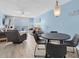 Open floor plan featuring a dining area with a modern chandelier and an ocean view at 18650 Gulf Blvd # 203, Indian Shores, FL 33785