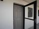 Welcoming entrance to the unit with a modern door and convenient access at 18650 Gulf Blvd # 203, Indian Shores, FL 33785