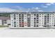 Exterior of beachfront condos with spacious balconies overlooking the white sandy beach at 18650 Gulf Blvd # 203, Indian Shores, FL 33785