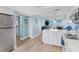 Open-concept living space with a well-equipped kitchen, and views of the water at 18650 Gulf Blvd # 203, Indian Shores, FL 33785
