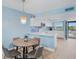 Dining area adjacent to updated kitchen in living space with views of ocean at 18650 Gulf Blvd # 203, Indian Shores, FL 33785