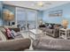 Beautiful living room with a view of the ocean, comfortable seating, and bright, cheerful decor at 18650 Gulf Blvd # 203, Indian Shores, FL 33785