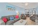 Open-concept living room flows seamlessly into the dining area and updated kitchen at 18650 Gulf Blvd # 203, Indian Shores, FL 33785