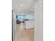 Inviting living room with ocean view, seamlessly connecting to the kitchen and dining area at 18650 Gulf Blvd # 203, Indian Shores, FL 33785