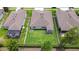 Aerial view of homes showcasing well-maintained lawns, patios, and fenced backyards in a residential community at 18657 Obregan Dr, Spring Hill, FL 34610