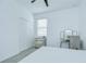 Bright bedroom features a ceiling fan, window with blinds, and a mirrored vanity table at 18657 Obregan Dr, Spring Hill, FL 34610