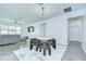 Contemporary dining area boasts a modern chandelier, seating for four, and neutral tones at 18657 Obregan Dr, Spring Hill, FL 34610