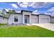 Charming single-story home with well-manicured lawn and a modern design at 18657 Obregan Dr, Spring Hill, FL 34610
