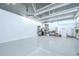 Spacious three-car garage featuring a finished ceiling with ceiling fans and plenty of room for storage at 18657 Obregan Dr, Spring Hill, FL 34610