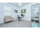 Bright home office features a ceiling fan, desk, chair, and built-in bookcase at 18657 Obregan Dr, Spring Hill, FL 34610