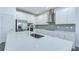 Bright kitchen with white cabinetry, stainless steel appliances, and a large center island at 18657 Obregan Dr, Spring Hill, FL 34610