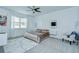 Relaxing main bedroom with neutral tones, a ceiling fan, and large windows bringing in natural light at 18657 Obregan Dr, Spring Hill, FL 34610