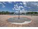 Community splash pad next to swimming pool with seating for parents to watch their children at 18657 Obregan Dr, Spring Hill, FL 34610