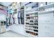 A large walk-in closet with custom shelves, drawers, and storage spaces for organization at 18657 Obregan Dr, Spring Hill, FL 34610