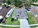 Aerial view of the property showcasing its spacious layout and well-maintained landscaping at 1919 Oswego Dr, Holiday, FL 34691