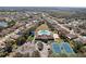 Community amenities including a pool, clubhouse, tennis courts, green space, and parking at 1919 Oswego Dr, Holiday, FL 34691