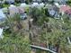 Aerial view of the property showing the lot's boundaries and the surrounding neighborhood at 1919 Oswego Dr, Holiday, FL 34691