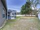 Fully fenced backyard with large, screened in lanai at 1919 Oswego Dr, Holiday, FL 34691