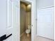 Small toilet room with tiled floor and a door to a closet at 1919 Oswego Dr, Holiday, FL 34691